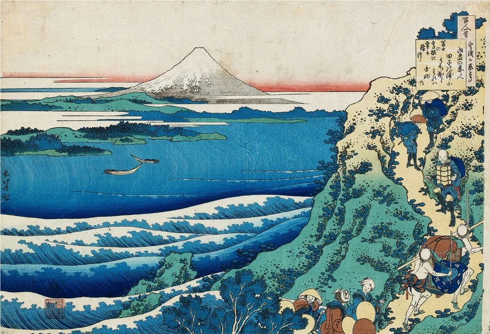 Mount Fuji beyond blue water, with travellers on a hillside path.